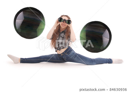 Attractive smiling young girl with binoculars 84630936