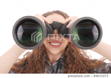 Attractive smiling young girl with binoculars 84631073