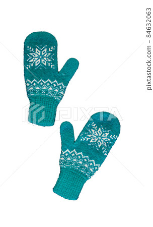 pair of blue knitted mittens with christmas pattern isolated on 84632063