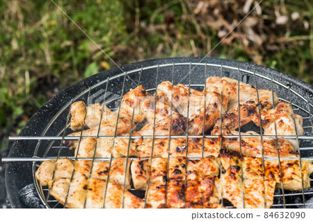 meat on the BBQ grill 84632090