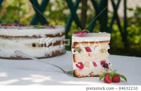 Cake with fruits and berries in jelly on white background Cake with fruits and berries in jelly on white background 84632210