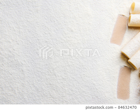 Whole wheat Italian pasta - raw tortiglioni- in the corner of a white coloured background with copy space for food advertisement Whole wheat Italian pasta - raw tortiglioni- in the corner of a white coloured background with copy space for food advertisement 84632470