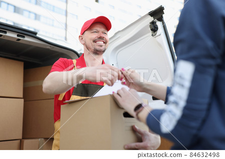 Courier and receiver make trade with signature on document for order Courier and receiver make trade with signature on document for order 84632498