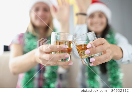 Best friends doing clink with glasses filled with tasty champagne drink Best friends doing clink with glasses filled with tasty champagne drink 84632512