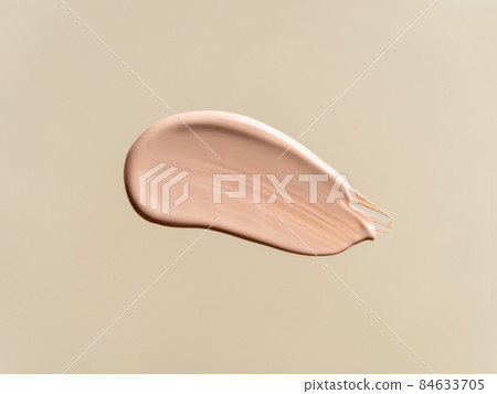 Liquid foundation on nude beige background Liquid foundation on nude beige background 84633705