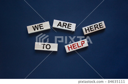 Wooden blocks with text 'we are here to help'. Beautiful white background, copy space. Business concept. Wooden blocks with text 'we are here to help'. Beautiful white background, copy space. Business concept. 84635111