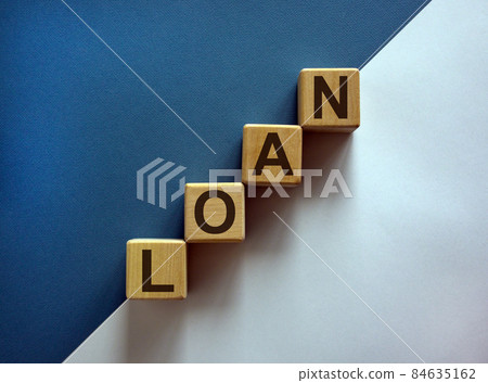 Wood block with word 'loan' stacking as step stair on paper blue and white background, copy space. Business concept success process. Wood block with word 'loan' stacking as step stair on paper blue and white background, copy space. Business concept success process. 84635162