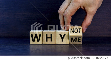 Why not me symbol. Businessman turns a cube and changes words why me to why not. Beautiful dark grey background. Business and why not me concept. Copy space. 84635173