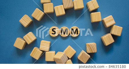SMM, social media marketing symbol. Wooden circles with word 'SMM - social media marketing' on beautiful blue background, copy space. Business, SMM - social media marketing concept. SMM, social media marketing symbol. Wooden circles with word 'SMM - social media marketing' on beautiful blue background, copy space. Business, SMM - social media marketing concept. 84635180