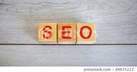 Concept word seo on cubes on a beautiful white wooden table. Concept word seo on cubes on a beautiful white wooden table. 84635222