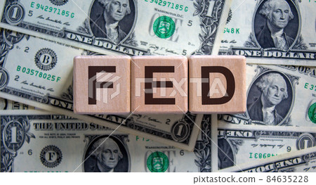 Wood cubes with word 'FED' on a beautiful background from dollar bills. Business concept, copy space. Wood cubes with word 'FED' on a beautiful background from dollar bills. Business concept, copy space. 84635228