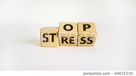 Stop stress and be health symbol. Turned cubes and changed words 'stress' to 'stop'. Beautiful white background. Psychological, business and stop stress concept. Copy space. Stop stress and be health symbol. Turned cubes and changed words 'stress' to 'stop'. Beautiful white background. Psychological, business and stop stress concept. Copy space. 84635230