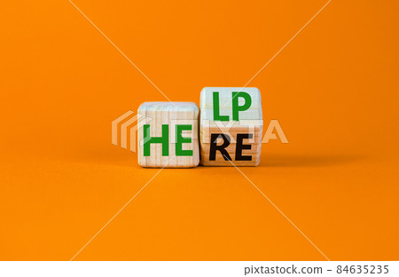 Help is here and support symbol. Turned a wooden cube and changed the word help to here. Beautiful orange background, copy space. Business, motivational, support and help is here concept. Help is here and support symbol. Turned a wooden cube and changed the word help to here. Beautiful orange background, copy space. Business, motivational, support and help is here concept. 84635235