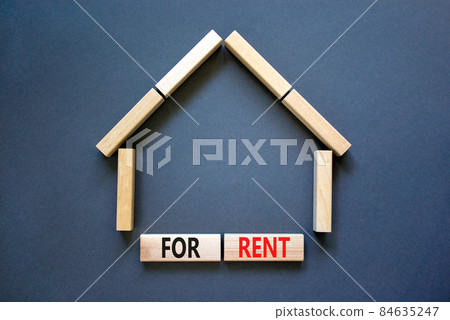House for rent symbol. Concept words 'For rent' on wooden blocks near miniature house. Beautiful grey background, copy space. Business and house for rent concept. House for rent symbol. Concept words 'For rent' on wooden blocks near miniature house. Beautiful grey background, copy space. Business and house for rent concept. 84635247