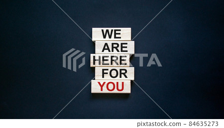 Wooden blocks with text 'we are here for you'. Beautiful black background, copy space. Business concept. Wooden blocks with text 'we are here for you'. Beautiful black background, copy space. Business concept. 84635273