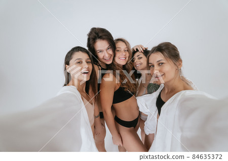 Diverse models wearing comfortable underwear take selfie Diverse models wearing comfortable underwear take selfie 84635372