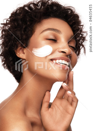 African American skincare models with perfect skin and curly hair. Beauty spa treatment concept. African American skincare models with perfect skin and curly hair. Beauty spa treatment concept. 84635455