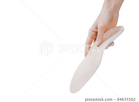 Orthopedic insole isolated on a white background. Medical insoles. Treatment and prevention of flat feet and foot diseases. Foot care, feet comfort. Wear comfortable shoes. Flat Feet Correction. Orthopedic insole isolated on a white background. Medical insoles. Treatment and prevention of flat feet and foot diseases. Foot care, feet comfort. Wear comfortable shoes. Flat Feet Correction. 84635502