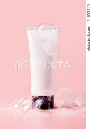 Facial cleanser tube with soapy bubbles. Beauty skin care cosmetic packaging mockup Facial cleanser tube with soapy bubbles. Beauty skin care cosmetic packaging mockup 84635549