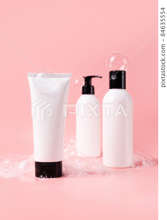 Beauty products set with soapy bubbles. Skin, body and hair care cosmetic bottles mockup Beauty products set with soapy bubbles. Skin, body and hair care cosmetic bottles mockup 84635554