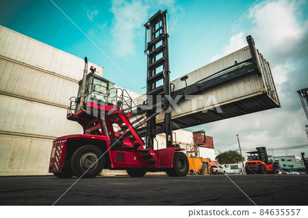 Cargo container for overseas shipping in shipyard with heavy machine . Cargo container for overseas shipping in shipyard with heavy machine . 84635557