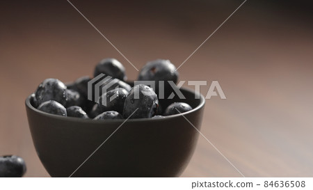 fresh washed blueberries in black bowl fresh washed blueberries in black bowl 84636508