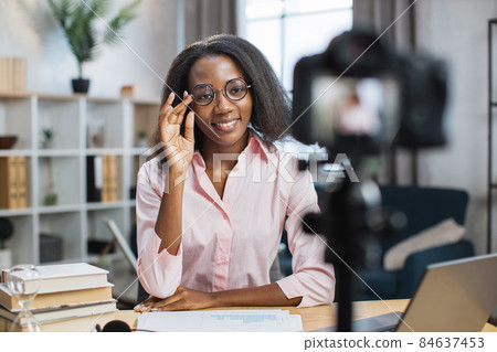 African teacher using video camera for online lessons African teacher using video camera for online lessons 84637453