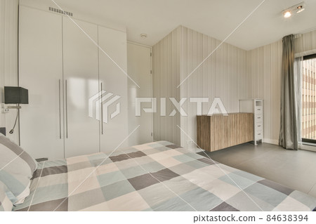 Stylish interior of contemporary bedroom with comfortable furniture 84638394