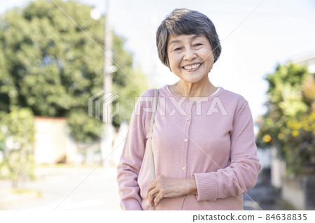 Smiley senior woman looking at the camera portrait 84638835