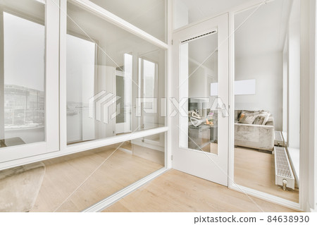 Modern room with wooden floor and white walls 84638930