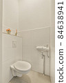 Interior of small clean restroom in miniature style 84638941