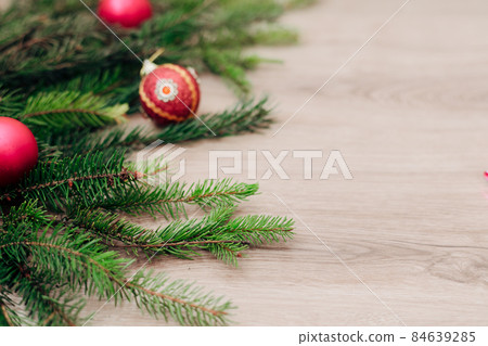 Christmas Tree Branches and on a Wooden Background with Copy Space 84639285
