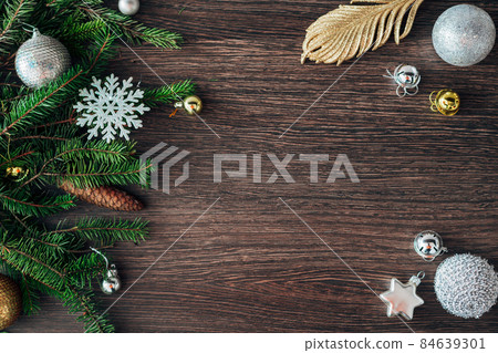 Christmas Tree Branches and Snowflakes on a Brown Background with CopySpace 84639301