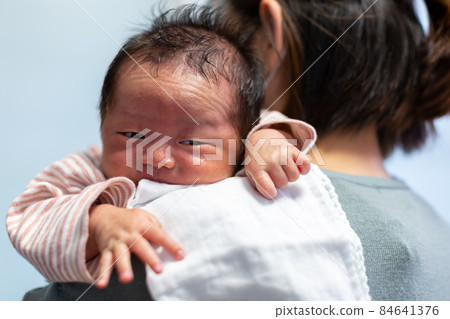 Breastfeeding mom and 1 month old baby Breastfeeding mom and 1 month old baby 84641376