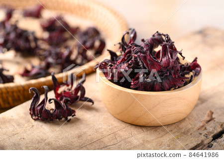 Dry roselle (Hibiscus sabdariffa) in bowl, Food coloring and ingredient in beverage 84641986