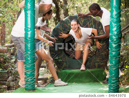 Friends having fun at adventure park 84643978