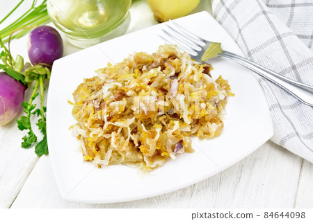 Turnip fried in plate on white board Turnip fried in plate on white board 84644098