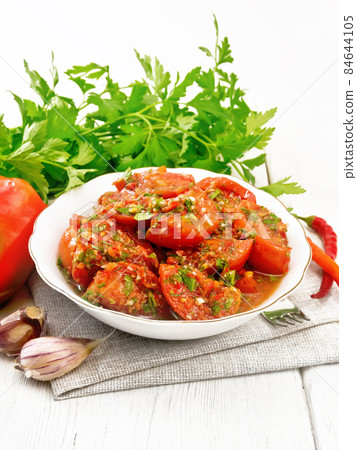Tomatoes Korean in plate on wooden board 84644105
