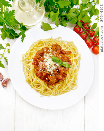 Spaghetti with bolognese on light board top Spaghetti with bolognese on light board top 84644108