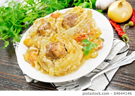 Pasta with meatballs in plate on towel 84644146