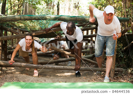 Friends having fun at adventure park 84644536