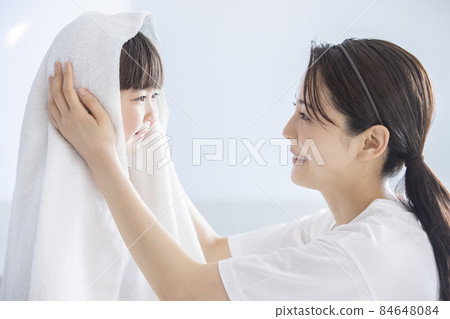 Girl doing towel drying Girl doing towel drying 84648084
