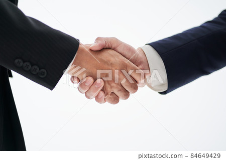Asian business person shaking hands on a white background Asian business person shaking hands on a white background 84649429