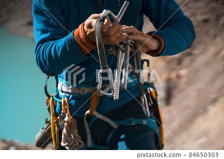 Man holds an ice crew in his hands. Man holds an ice crew in his hands. 84650303