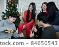 Party of group young Asian with pour wine for drink at home in celebrate Christmas festival. 84650543