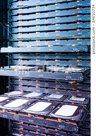 Cluster of hard drives inside open tray Cluster of hard drives inside open tray 84650734