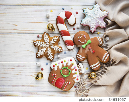 Christmas gingerbread with christmas decorations on white wooden table Christmas gingerbread with christmas decorations on white wooden table 84651067
