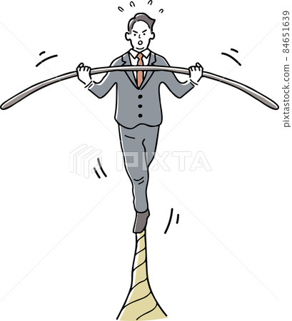 A man walking a tightrope while balancing 84651639