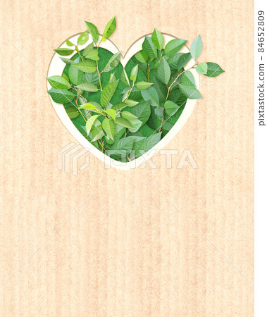 Heart shape hole and green leaves on cardboard texture. Ecology concept Heart shape hole and green leaves on cardboard texture. Ecology concept 84652809