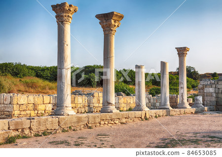 Fantastic sunset over ruins of the Basilica in ancient city Chersonese - national historical and archaeological reserve. Fantastic sunset over ruins of the Basilica in ancient city Chersonese - national historical and archaeological reserve. 84653085